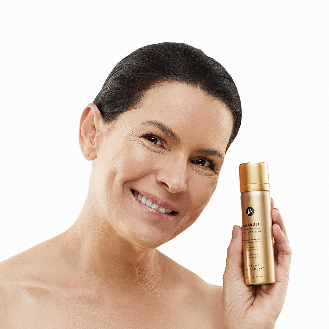 Model holding a can of AirBrush Hydrating Foundation